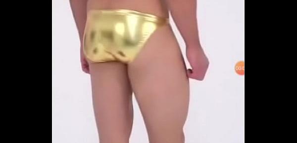  Guy in metallic golden bikini